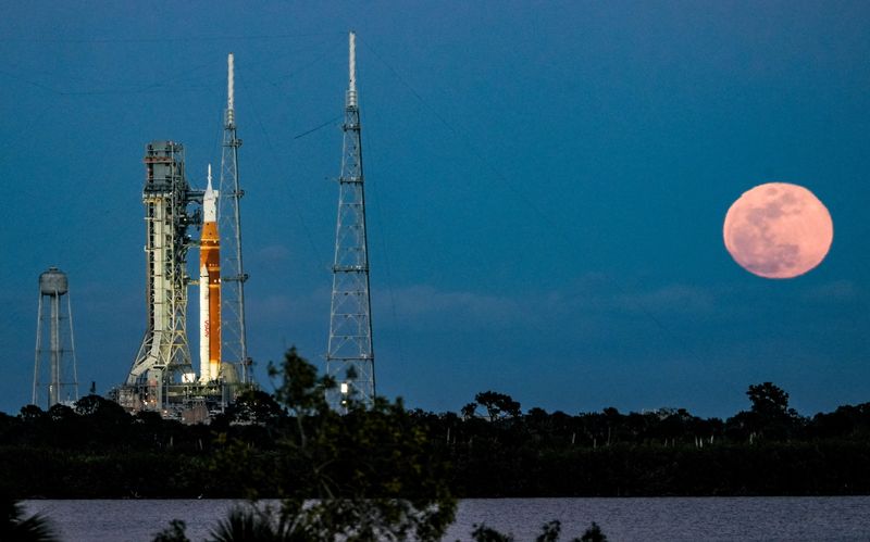 The full moon rises as Artemis II sits on Pad 39B at Kennedy Space Center February 1, 2026. The Space Launch System rocket will undergo testing this week to determine its readiness for launch. Craig Bailey/FLORIDA TODAY via USA TODAY NETWORK