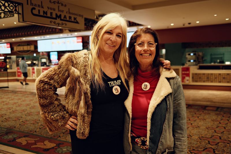 Lisa Macci (left) and Cindy Levinson (right), of the conservative women's group Ladies of Liberty, appear at the Cinemark Bistro theater in Boca Raton for the premier of the "Melania" documentary on Jan. 30, 2026.