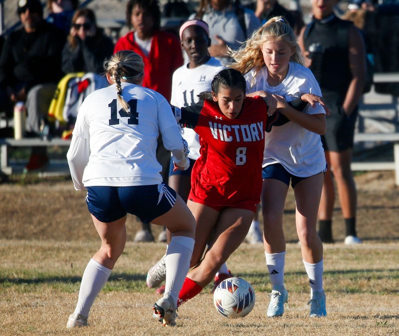 Victory Christian's Sylvia Rodriguez fights between two St. Edward's players on Monday in the Class 1A, Region 2 quarterfinals.