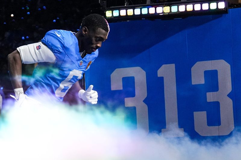 Detroit Lions cornerback Terrion Arnold (6) runs onto the field for players introduction before the Thanksgiving game against Green Bay Packers at Ford Field in Detroit on Thursday, Nov. 27, 2025.