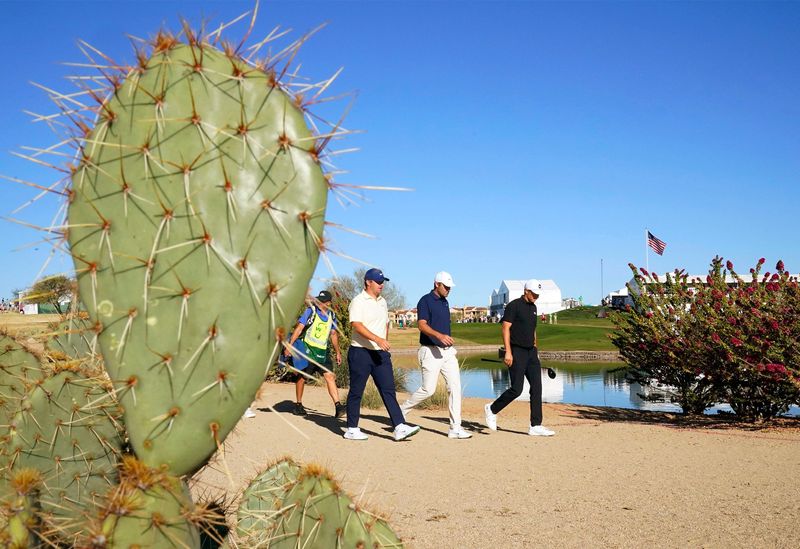 Chris Gotterup, Scottie Scheffler, and Jordan Spieth walk down the 15th hole during round one at the WM Phoenix Open on Feb. 5, 2026, at TPC Scottsdale.