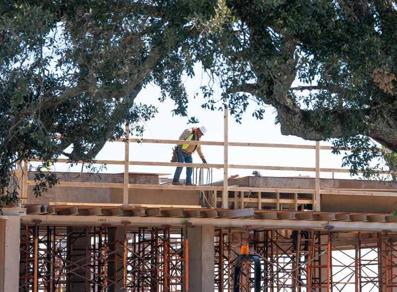 Crews work on the construction of a new Homewood Suites by Hilton hotel along Gregory Street in downtown Pensacola on Feb. 5, 2026.