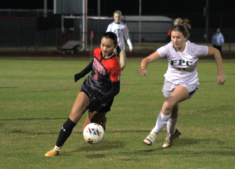 Creekside forward Savannah Hartford (3) turns upfield as Flagler Palm Coast midfielder Penelope McDonald (14) defends during an FHSAA Region 1-7A high school girls soccer playoff on Feb. 5, 2026. [Clayton Freeman/Florida Times-Union]