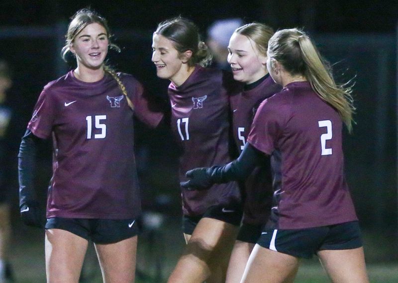 Niceville players celebrate after a second half goal during the Niceville Navarre girls regional quarterfinal soccer match at Niceville. Niceville advanced with a 6-0 win.