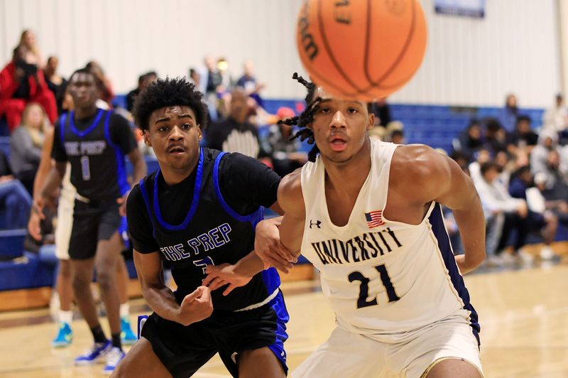 San Jose Prep's Denoris Young (3) and University Christian's Preston Pride (21) eye the ball during the second quarter of an FHSAA boys basketball District 3-2A semifinal.