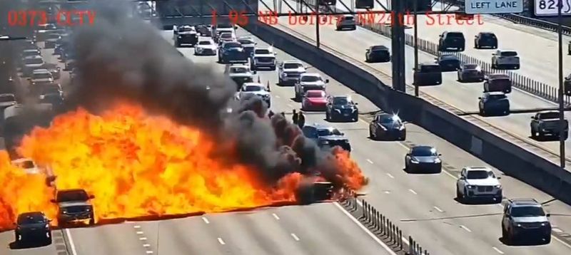 A traffic camera captures the moment a car burst into flames northbound on Interstate 95 near Copans Road in Pompano Beach on Friday, Feb. 6, 2026.