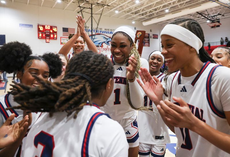 St. Lucie West Centennial celebrates winning the girls District 7-7A basketball final 70-45 against Treasure Coast on Feb. 6, 2026, in Port St. Lucie.