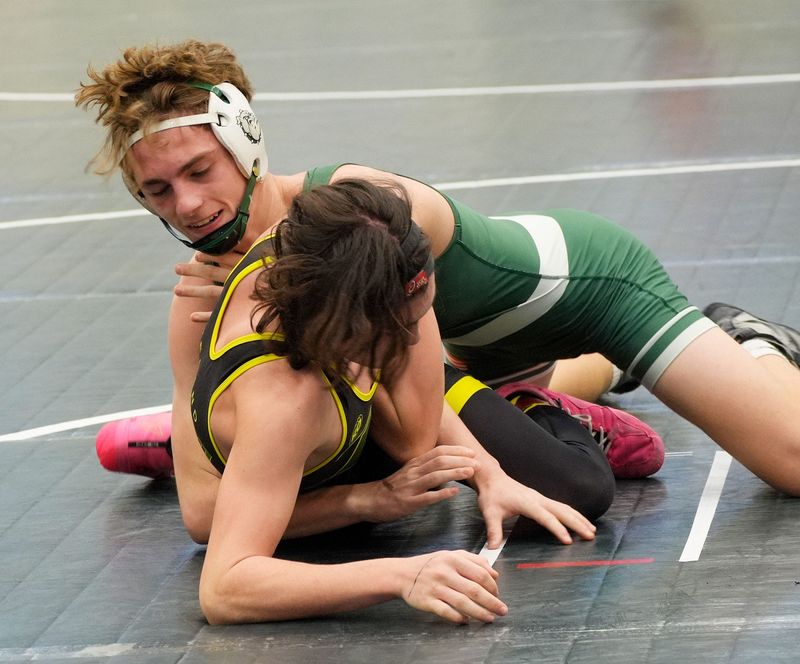 Flagler Palm Coast’s Robert Twilley wrestles DeLand's Atticus Contois during the Five Star boys wrestling tournament Saturday, Feb. 7, 2026 hosted by Flagler Palm Coast.
