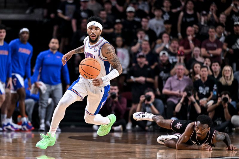 Feb 7, 2026; College Station, Texas, USA; Florida Gators guard Boogie Fland (0) dribbles the ball against the Texas A&M Aggies during the first half at Reed Arena. Mandatory Credit: Maria Lysaker-Imagn Images