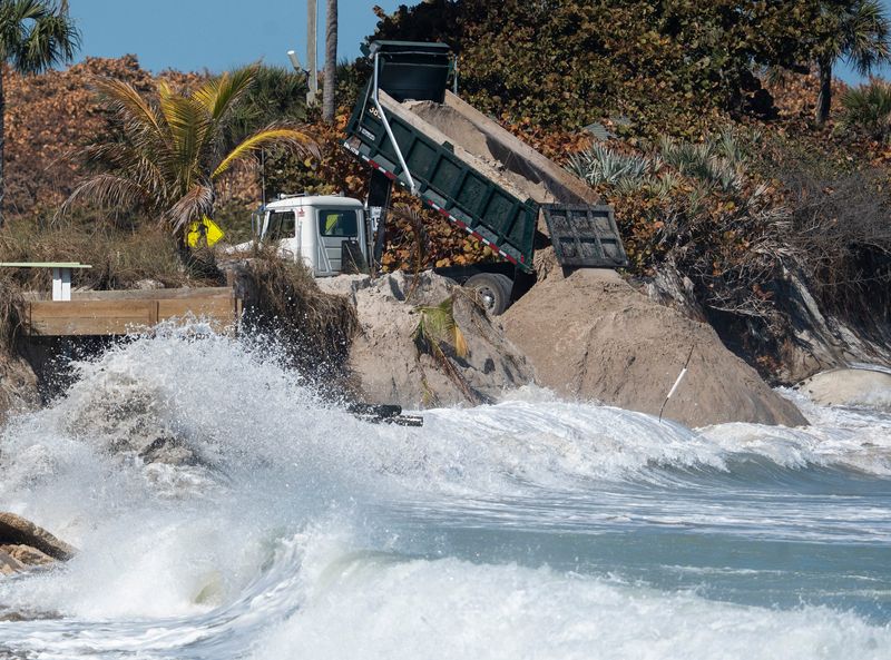 Sand is being placed on Fort Pierce South Beach from the Jetty Park parking lot, Feb. 10, 2026. A state of emergency has been declared to fight back the ocean at multiple locations experiencing unprecedented erosion along Fort Pierce South Beach.
