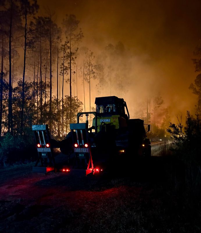 Florida Forest Service firefighters battle a 70-acre wildfire on Tuesday, Feb. 10. The fire near the Volusia Speedway shut down part of State Road 40 between U.S. 17 in Barberville and the Volusia Speedway.
