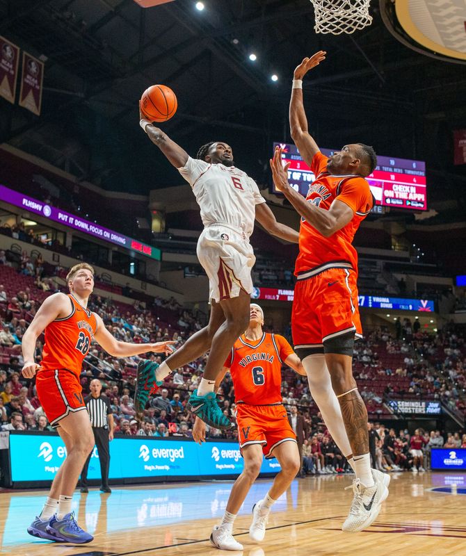 Florida State Seminoles guard Robert McCray V. (6) soars through the air as he goes in to dunk the ball. The Virginia Cavaliers defeated the Florida State Seminoles 61-58 at the Tucker Civic Center on Tuesday, Feb. 10, 2026.