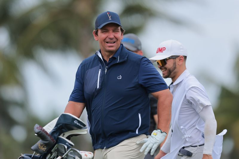 Apr 3, 2025; Miami, Florida, USA; Florida Gov. Ron DeSantis looks on after finishing the eighth hole during the Pro-Am round of the LIV Golf Miami golf tournament at Trump National Doral. Mandatory Credit: Sam Navarro-Imagn Images