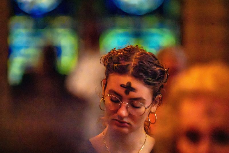 Scarlett White and others participate in Ash Wednesday service at The Church of Bethesda-by-the-Sea Wednesday March 5, 2025.