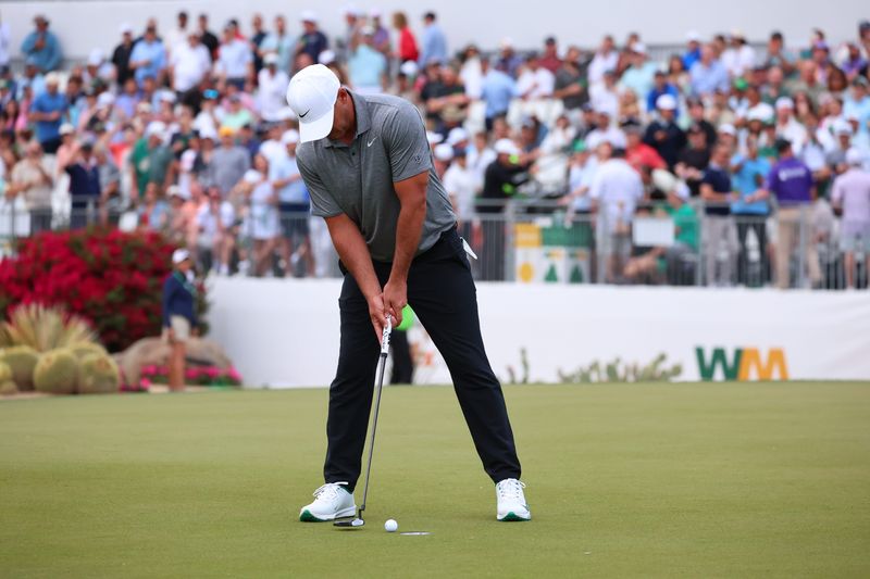 Feb 5, 2026; Scottsdale, Arizona, USA; Brooks Koepka of the United States putts on hole 16 during the first round of the WM Phoenix Open golf tournament. Mandatory Credit: Anna Carrington-Imagn Images