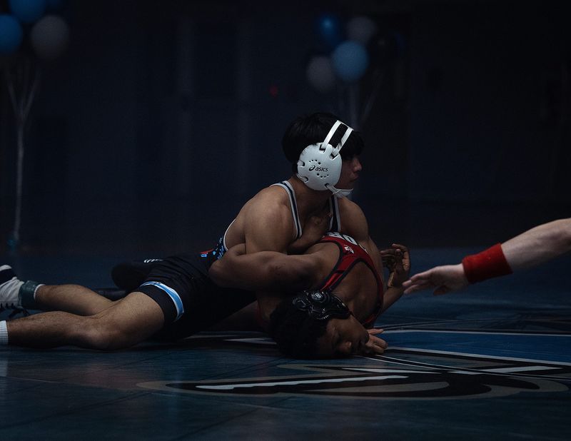 North Bay Haven's Koa DeLoach competes against Wewahitchka's OJ Hall in Panama City, Fla., Feb. 12, 2026. DeLoach, the top-ranked 120-pounder in Florida, signed with the Davidson Wildcats that same evening. (Tyler Orsburn/News Herald)