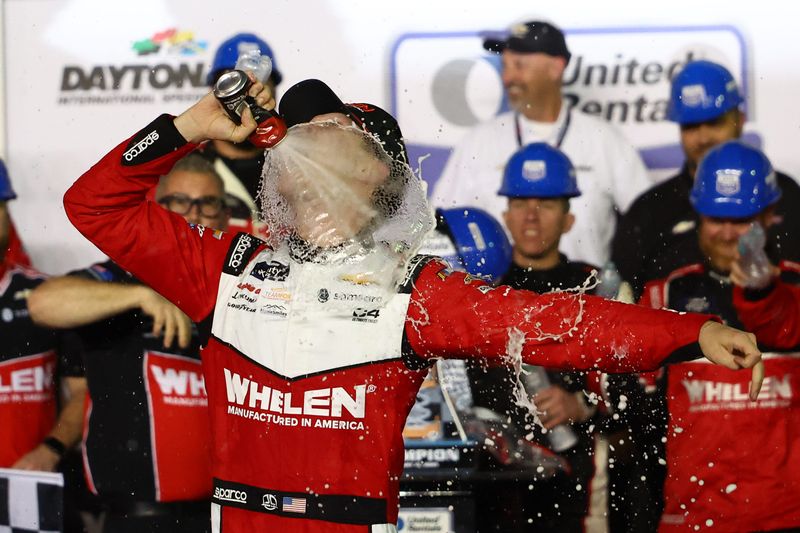 Feb 15, 2025; Daytona Beach, Florida, USA; Xfinity Series driver Jesse Love (2) reacts in victory lane after winning the United Rentals 300 at Daytona International Speedway. Mandatory Credit: Peter Casey-Imagn Images