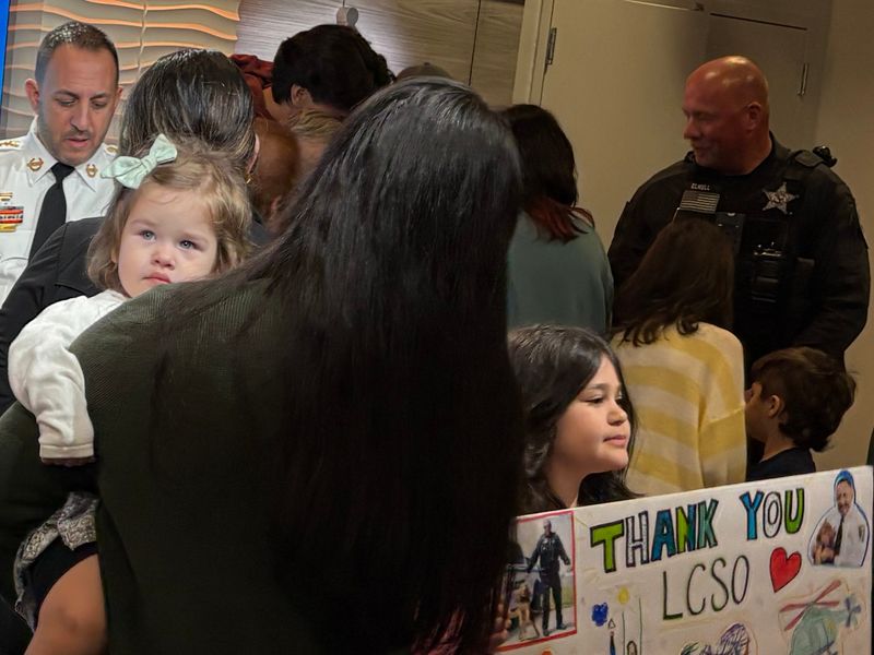The family of 78-year-old Joceli Coutinho, of Lehigh Acres, who authorities rescued after he was missing for nearly a day, on Thursday, Feb. 12, 2026, greeted Lee County Sheriff Carmine Marceno and the K9 that found Coutinho.