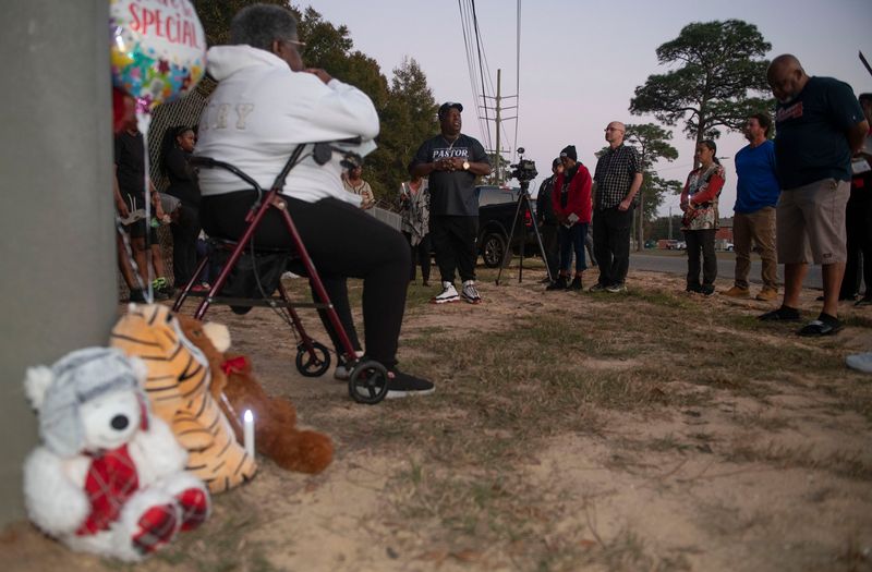 Pastor Vincent Dickens offers a prayer of remembrance for Jakaiden Smith during a candlelight vigil for the 5-year-old on Feb. 13, 2026. Smith was found dead, wrapped in towels and stuffed in a trash bag off Lillian Highway Feb. 6, 2026. His mother, Jalynda Smith, was charged with aggravated manslaughter in connection with his death.