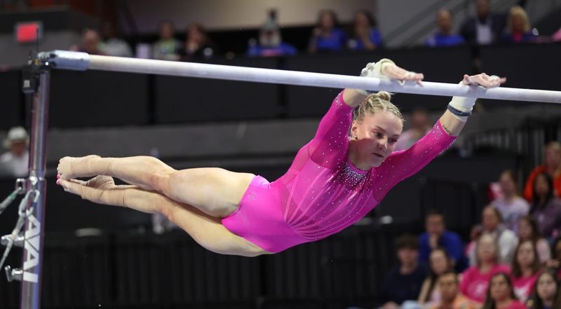 Florida Riley McCusker performs on the uneven bars performs on the uneven bars during a NCAA gymnastics meet at Steven C. O'Connell Center Exactek arena in Gainesville, FL on Friday, February 13, 2026. Oklahoma beat Florida 198.075-197.575.[Alan Youngblood/Gainesville Sun]
