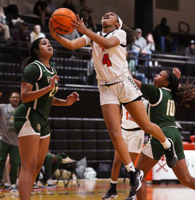 Orange Park Raiders Skylar Wilson (4) drives to the basket in the second period. Orange Park (20-7), hosted Fleming Island (16-11), in the FHSAA Region 1-5A Girls Basketball Playoff Friday night, February 13, 2026 in Fleming Island, Fla. Orange Park defeated Fleming Island 51-34. [Doug Engle/Florida Times-Union]