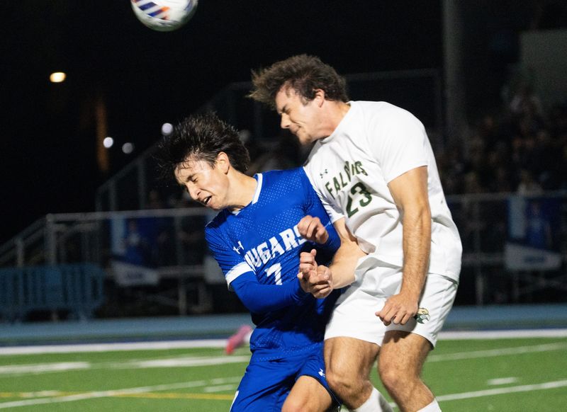 James Tomlinson of the Canterbury School boys soccer team and Jack Suprenand of Saint Stephen's go for the ball during a Class 1A-Region 3 title game at Canterbury in Fort Myers on Friday, Feb. 13, 2026. Canterbury won 2-0 and punched a ticket to the final 4.