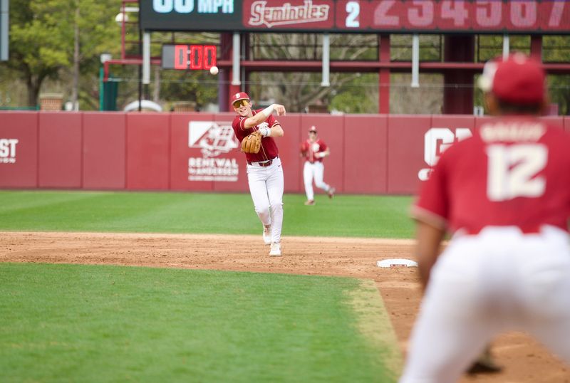Cal Fisher throws to Myles Bailey as Florida State baseball beat James Madison 16-5 on Saturday, Feb. 14 at Dick Howser Stadium