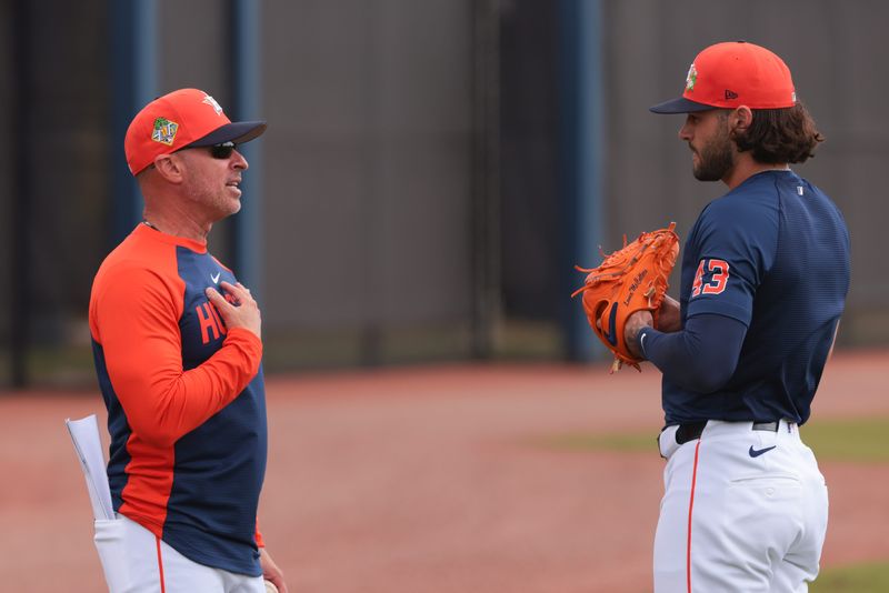 Astros manager Joe Espada talks to veteran pitcher Lance McCullers Jr., who may be in his final season with the club, during a spring training workout at CACTI Park of The Palm Beaches.