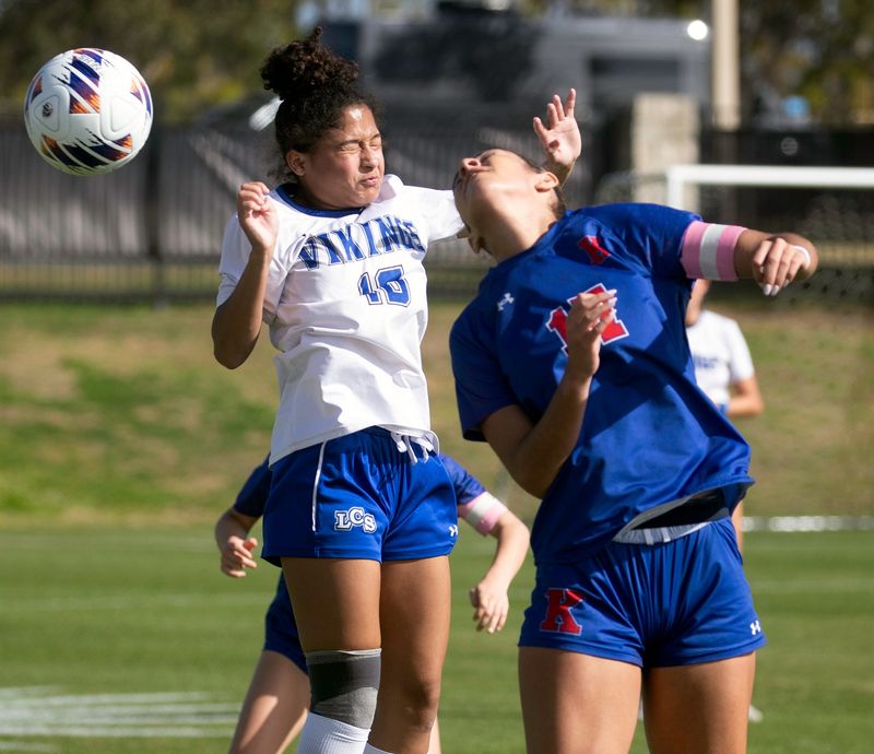 Lakeland Christian junior Finley Traffanstedt heads the ball away from King's Academy's Mia Mackrey on Tuesday morning in the semifinals of the 2026 FHSAA Class 2A Girls Soccer State Championships at Lake Myrtle Sports Complex.