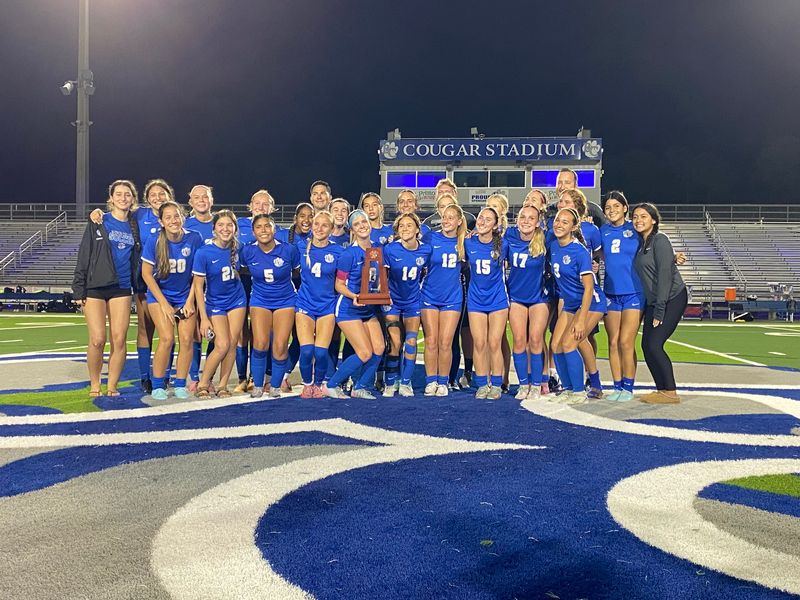 The Barron Collier girls soccer team poses with their trophy after defeating Estero 3-0 in the Class 4A regional final on February 17, 2026.