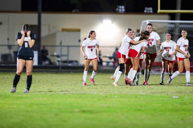 North Fort Myers Red Knights players celebrate after a goal by midfielder Jaelyn Hoefer (3) during the second half of the Class 5A Region 3 championship at Mariner High School in Cape Coral, Fla., on Tuesday, Feb. 17, 2026.