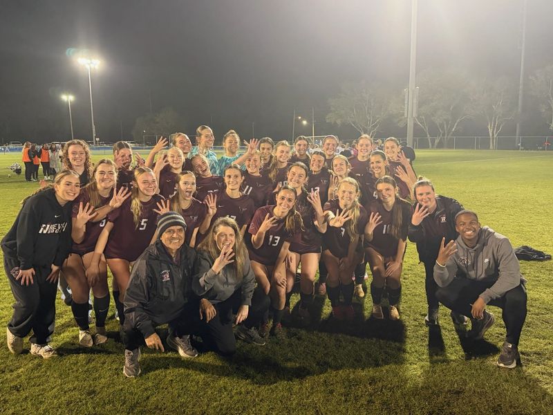 The Niceville girls soccer team celebrates Tuesday's 3-0 win over Bartram Trail for the Region 1-6A championship.