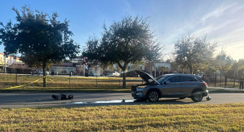A mini-dirt bike and vehicle are cordoned off the scene a fatal crash on Longleaf Pine Parkway outside Patriot Oaks Academy that resulted in a 12-year-old boy's death Feb. 17.