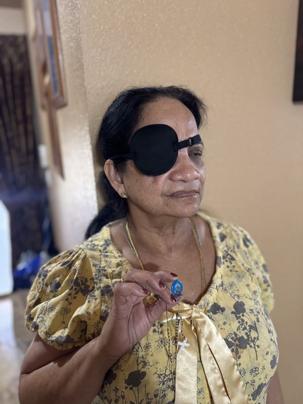 Leelamma Lal, a nurse who was beaten by a patient at HCA Palms West, holds the rosary and the image of Jesus he had the day of the attack on Feb. 18, 2025.