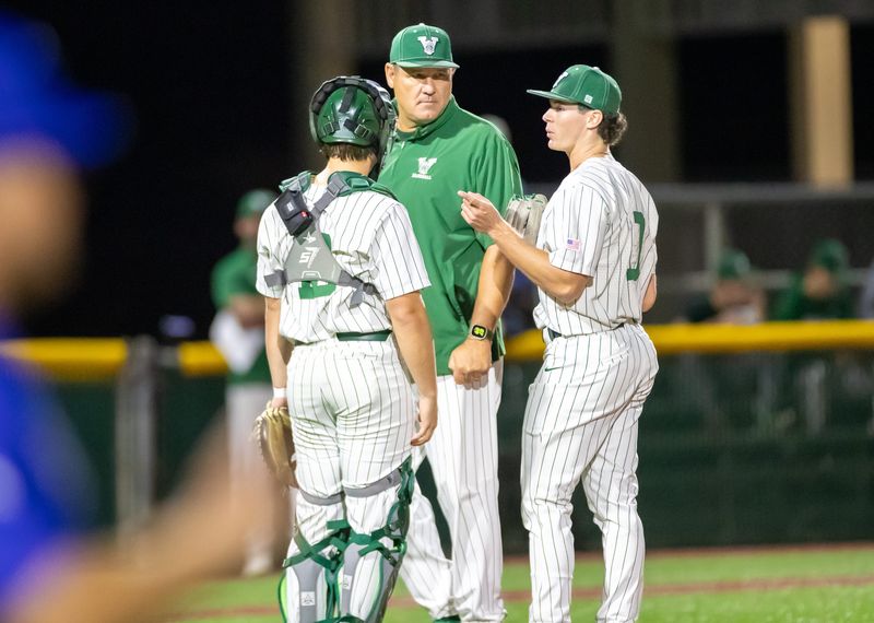 Venice and Canterbury School played a close game on Wednesday, Feb. 18, 2026 which the Indians won 2-1. Venice skipper Craig Faulkner talks with catcher Jon Mauro and pitcher Carter Cox while the umpires discussed an issue.