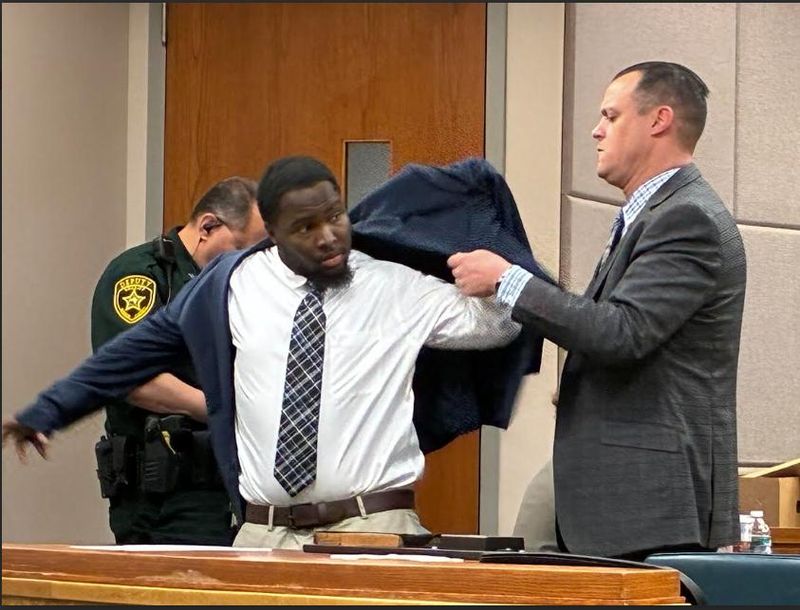 Defense attorney John Klein helps his client Mike Anthony Jones Jr. with his jacket at Jones' murder trial on Feb. 19, 2026 at the Marion County Judicial Center.