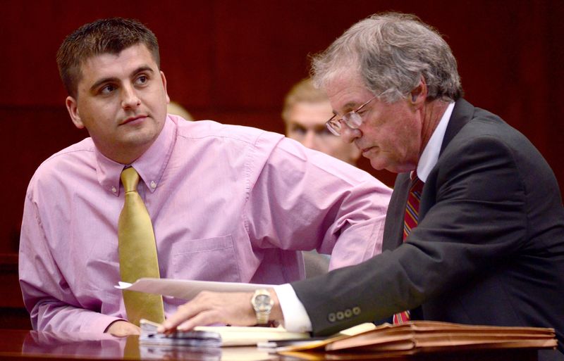 Jasmin Osmanovic, left, and his attorney Hank Coxe wait to appear before Circuit Judge Wendy Berger for his sentencing in the St. Johns County Court House on March 14, 2011. Osmanovic was sentenced to six months of probation for helping Quinn Hanna Gray fake her kidnapping and trying to extort $50,000 from her husband.