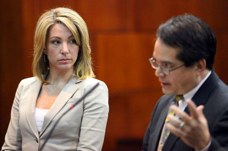 Quinn Gray stands with her attorney Mark Miller in Judge Wendy Berger's courtroom in the St. Johns County Courthouse on Feb. 11, 2011.