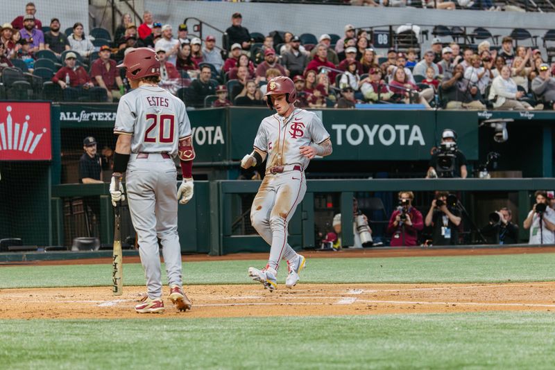 FSU baseball's Gabe Fraser touches home plate after being driven in to score in the Amegy Bank College Baseball Series at Globe Life Field in Arlington, Texas
