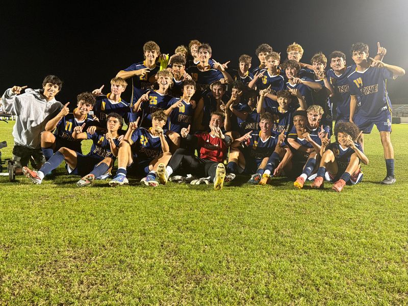 The Pine School boys soccer team celebrates its state championship on Saturday, Feb. 21, 2026 in Auburndale.