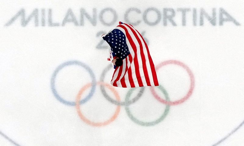 Connor Hellebuyck of United States celebrates after defeating Canada in the men's ice hockey gold medal game during the Milano Cortina 2026 Olympic Winter Games at Milano Santagiulia Ice Hockey Arena.