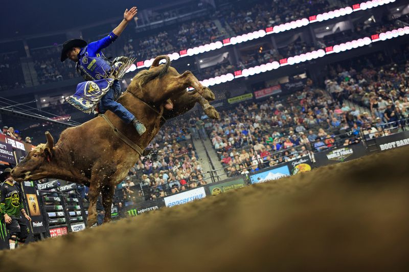 Alan de Souza rides Hay Train during PBR Unleash the Beast professional bull riding competition at VyStar Veterans Memorial Arena, Friday, Feb 20, 2026, in Jacksonville, Fla. Thousands came to see some of the best riders compete on the opening night, qualifying for tomorrow, as they tour 19 different cities. Felipe Furlan sits atop the pack leading with 89.65 points and runner-up is Maverick Smith with 87.50.