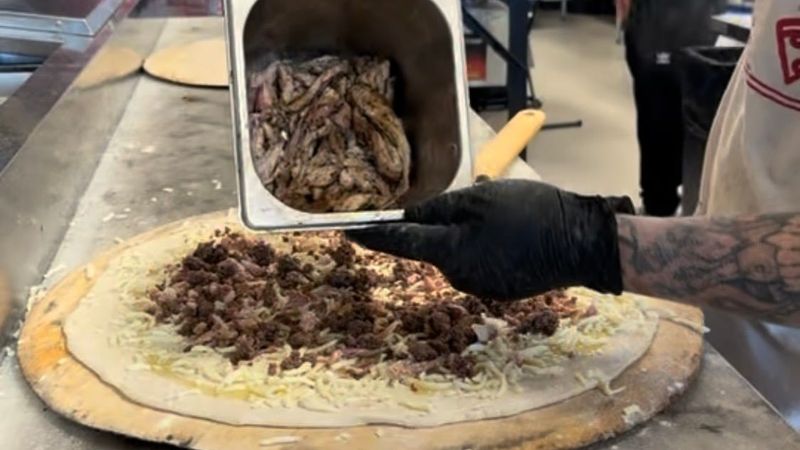 Frankie Cecere makes iguana pizza on Feb. 2, 2026, at Bucks Coal Fired in North Palm Beach, Fla.
