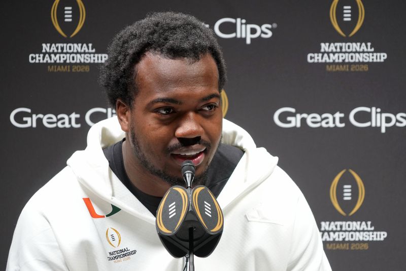 Jan 17, 2026; Miami Gardens, FL, USA; Miami Hurricanes defensive lineman Rueben Bain Jr. (4) talks to the media during media day for the 2025 College Football Playoff National Championship at Miami Beach Convention Center. Mandatory Credit: Kirby Lee-Imagn Images
