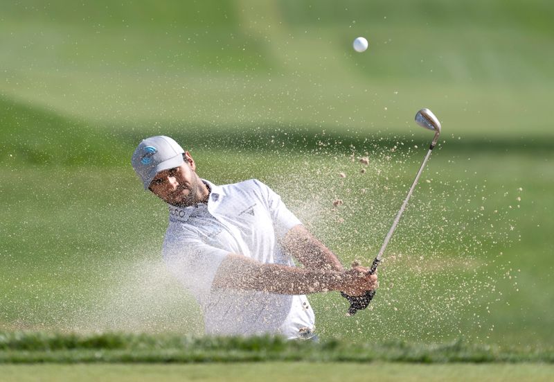 Aaron Rai blasts out of the sand on the 3rd hole during the first round of the Cognizant Classic in the Palm Beaches on February 26, 2026, in Palm Beach Gardens, Florida.