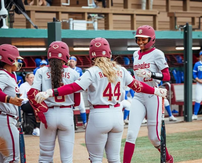 Kennedy Hard heads to home base with her teammates there to celebrate with her after a base hit that turned into a runs score against Florida Gulf Coast on Thursday, Feb. 26, 2026.