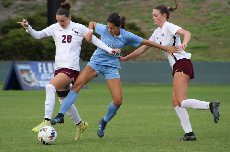 Chiles defender Abbey Giffin (28) and Lourdes midfielder Gianna Gray (21) challenge for possession during the FHSAA Class 5A high school girls soccer final in DeLand on Feb. 28, 2026. [Clayton Freeman/Florida Times-Union]