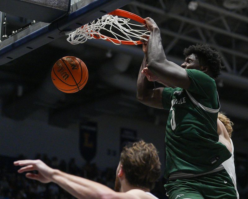 Jacksonville University forward Jaylen Jordon (0) slam dunks the ball during the second period. University of North Florida hosted Jacksonville University hosted in mens basketball SaturdayFebruary 28, 2026 in Jacksonville, Fla. JU defeated UNF 85-61. [Doug Engle/Florida Times-Union]