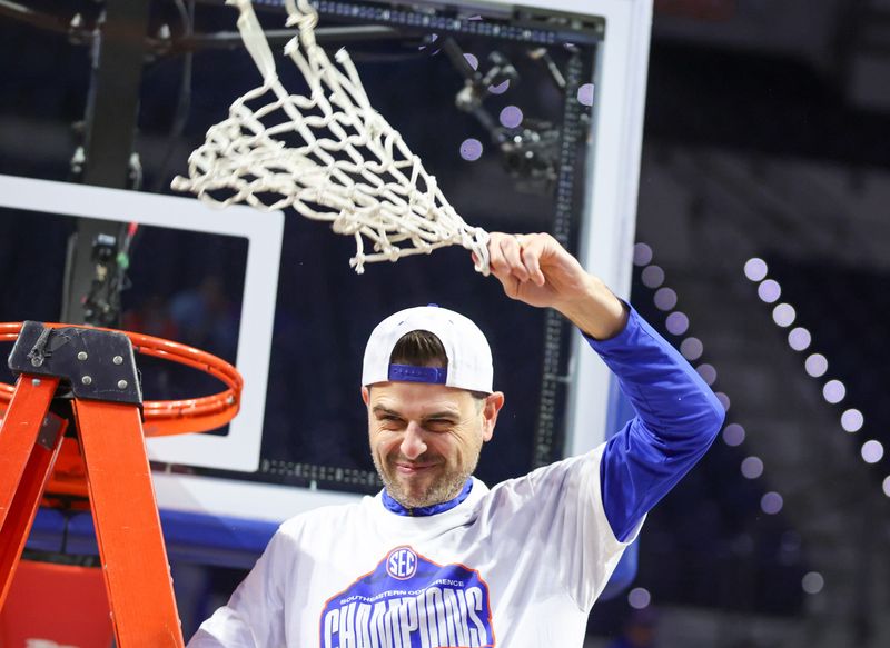 Florida head coach Todd Golden celebrates the 111-77 win over Arkansas and the SEC Championship after an NCAA basketball game at Steven C. O'Connell Center Exactek arena in Gainesville, FL on Saturday, February 28, 2026. [Alan Youngblood/Gainesville Sun]