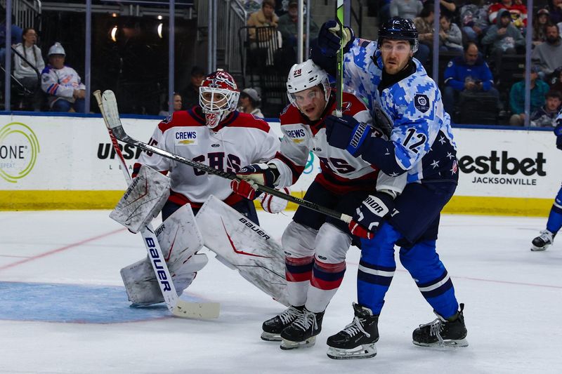 South Carolina Stingrays defenseman Ryan Orgel (29) and Jacksonville Icemen forward David Jankowski (12), right, vie for position in front of South Carolina Stingrays goaltender Seth Eisele (35) during an ECHL hockey game at Veterans Memorial Arena in Jacksonville, Fla., Saturday, Feb. 28, 2026. [Gary Lloyd McCullough/Provided by the Jacksonville Icemen]